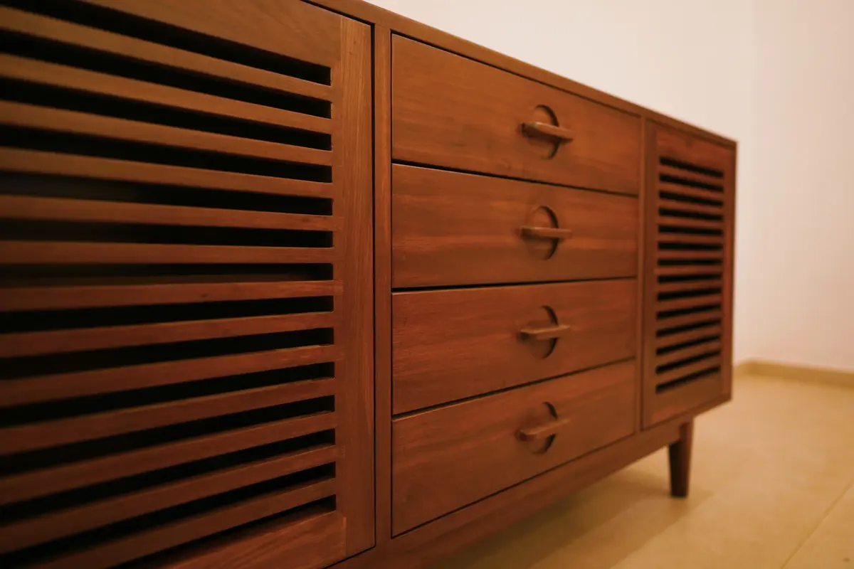 Teak entry console with vertical slats and grooved shutters